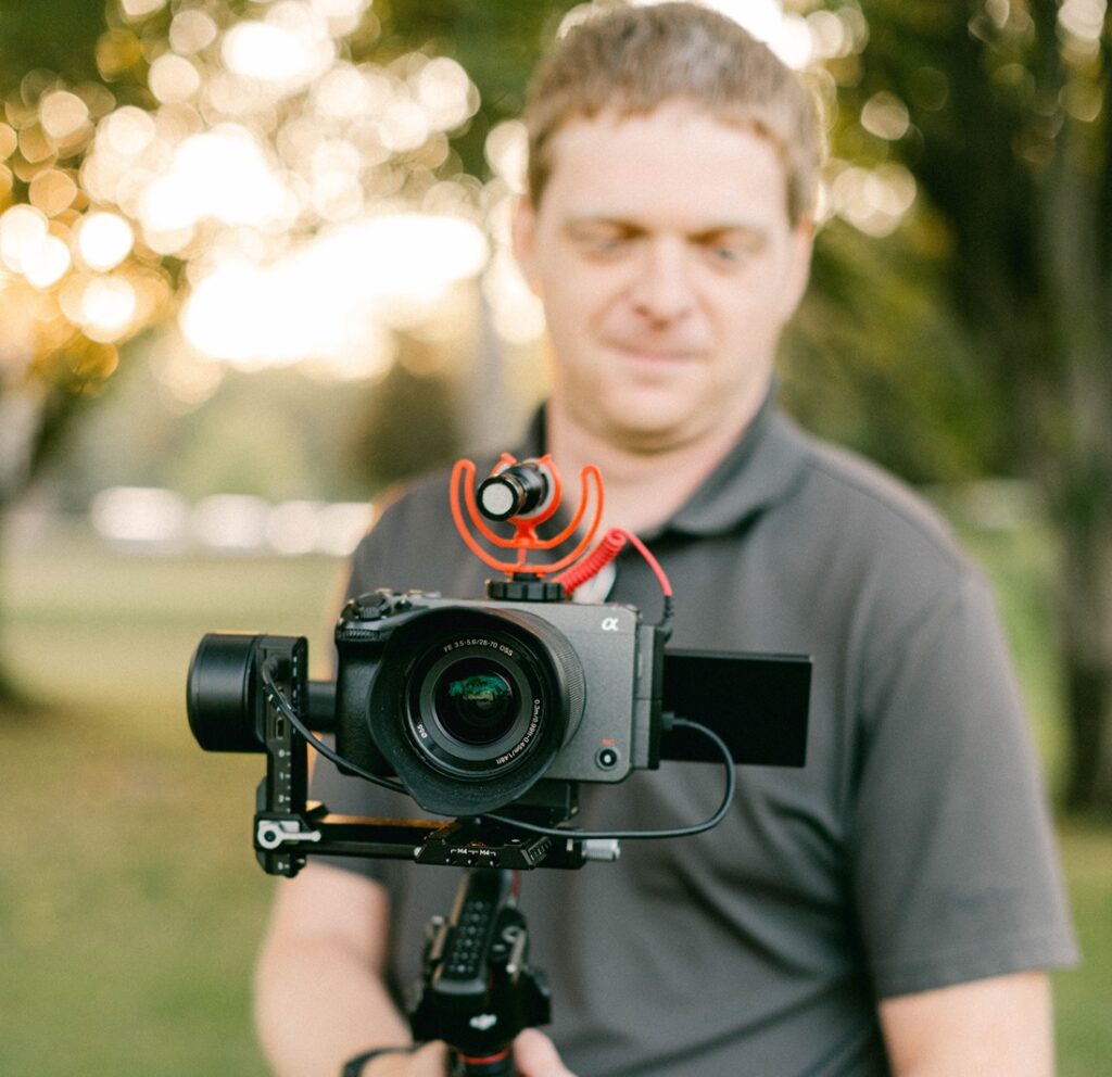 Professional wedding videographer at work during Indianapolis wedding ceremony