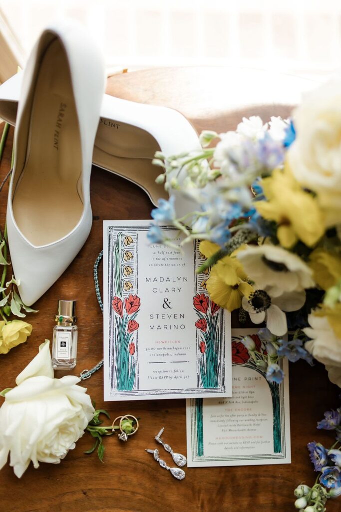 Madalyn and Steve wedding invites and details from a flat lay.