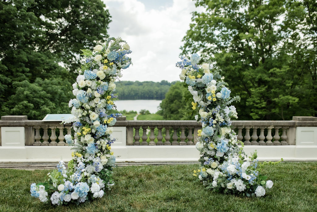 I do florals by sarah beautiful blue, yellow and white florals at newfields lilly house terrace.
