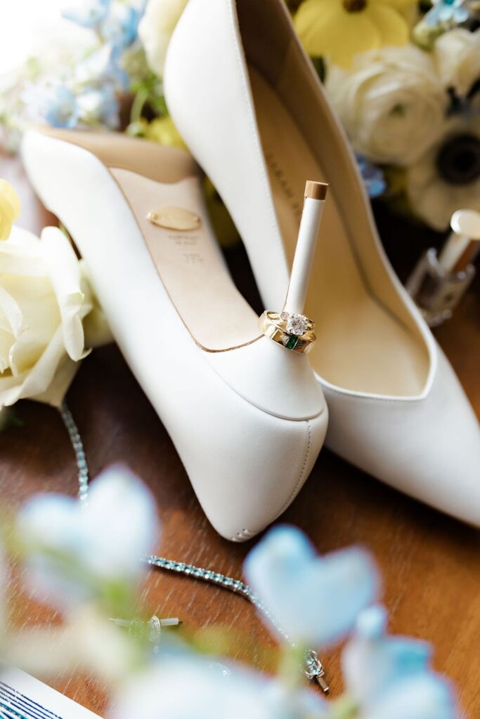 Bridal details of rings on heels.