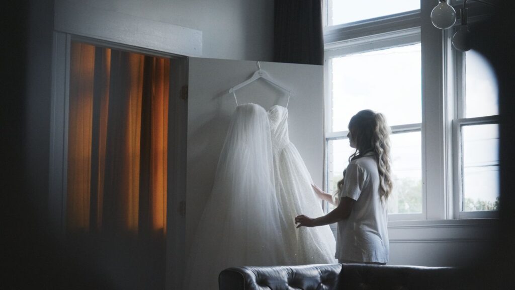 Star looking at her wedding dress before reading vows with Zach on their wedding day.