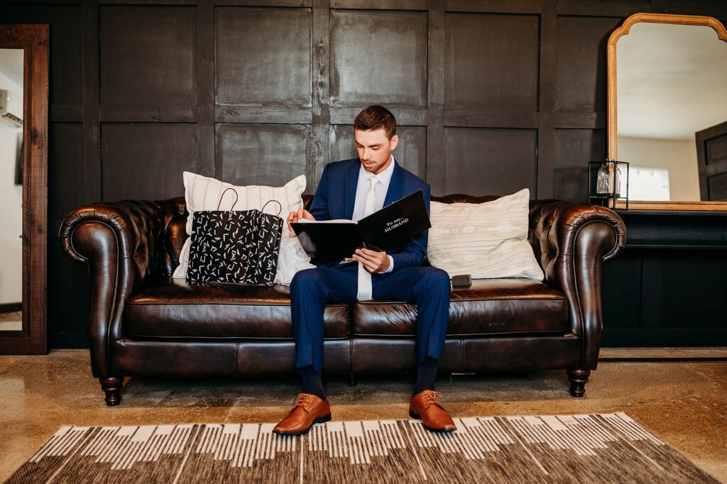 Groom reacting to his wedding gift.