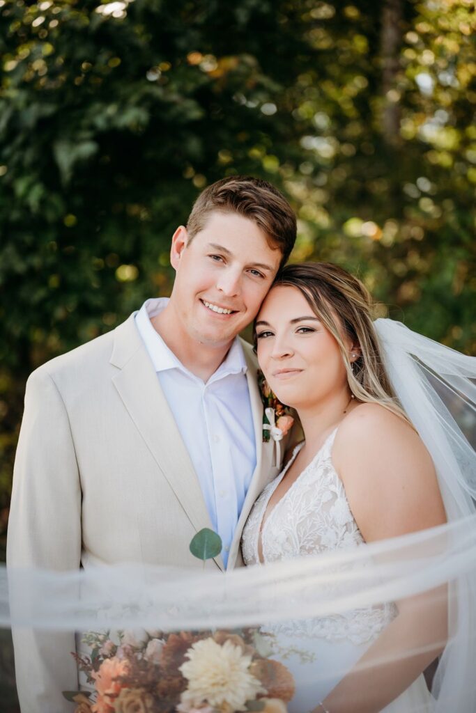 Wedding couple posing outside.