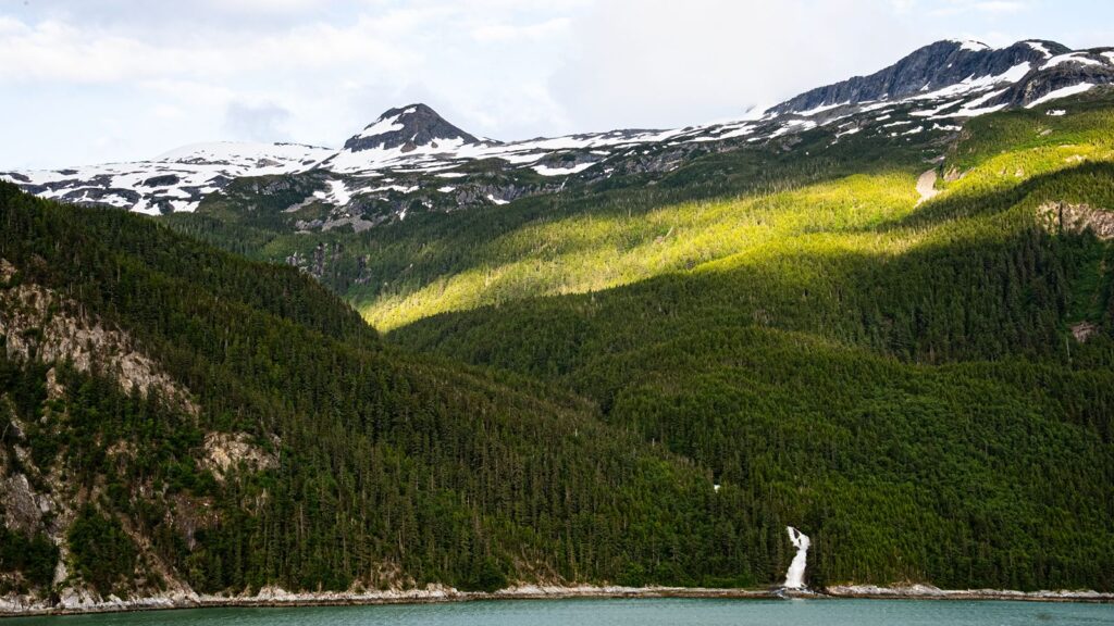 Alaskan mountains with beautiful waterfall.