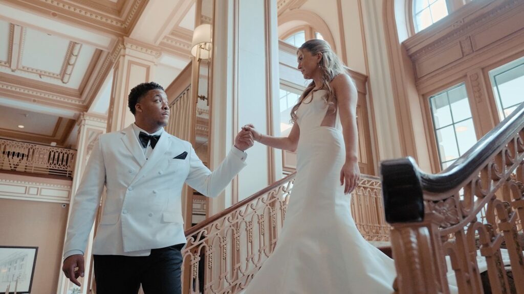 Wedding couple on grand staircase Indianapolis wedding.
